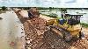 Power Bulldozer Komatsu D61px Pushing Dirt And Stone Building Road Foundation Over Water Sinking